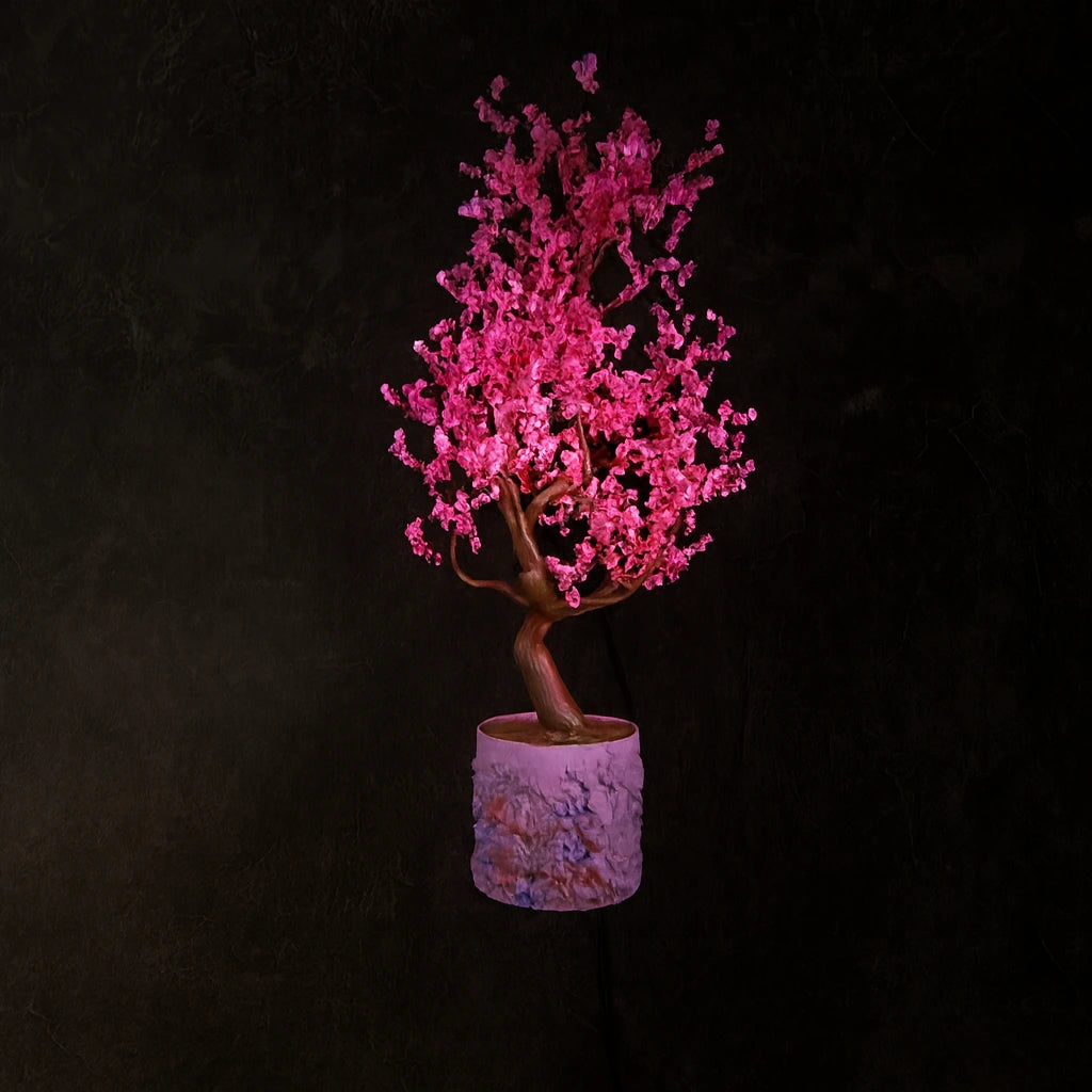 3D holographic display showing a pink blooming tree.