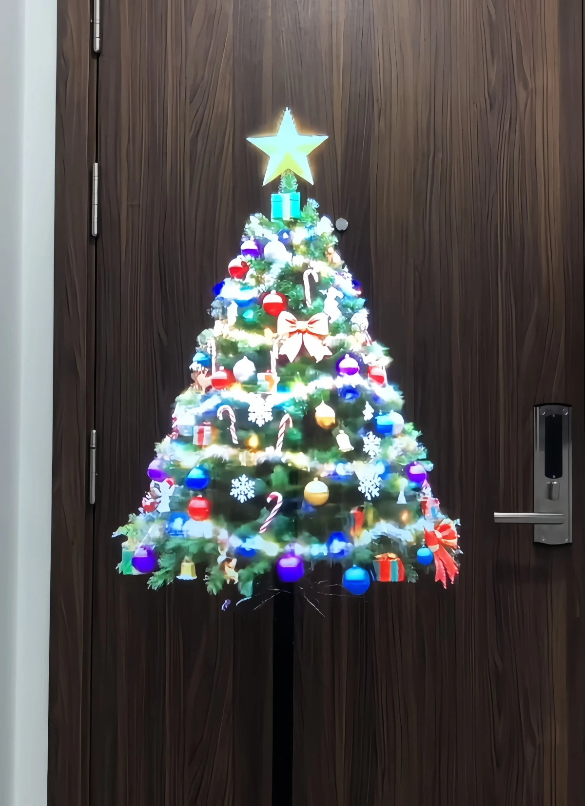 3D holographic display projecting a glowing Christmas tree.