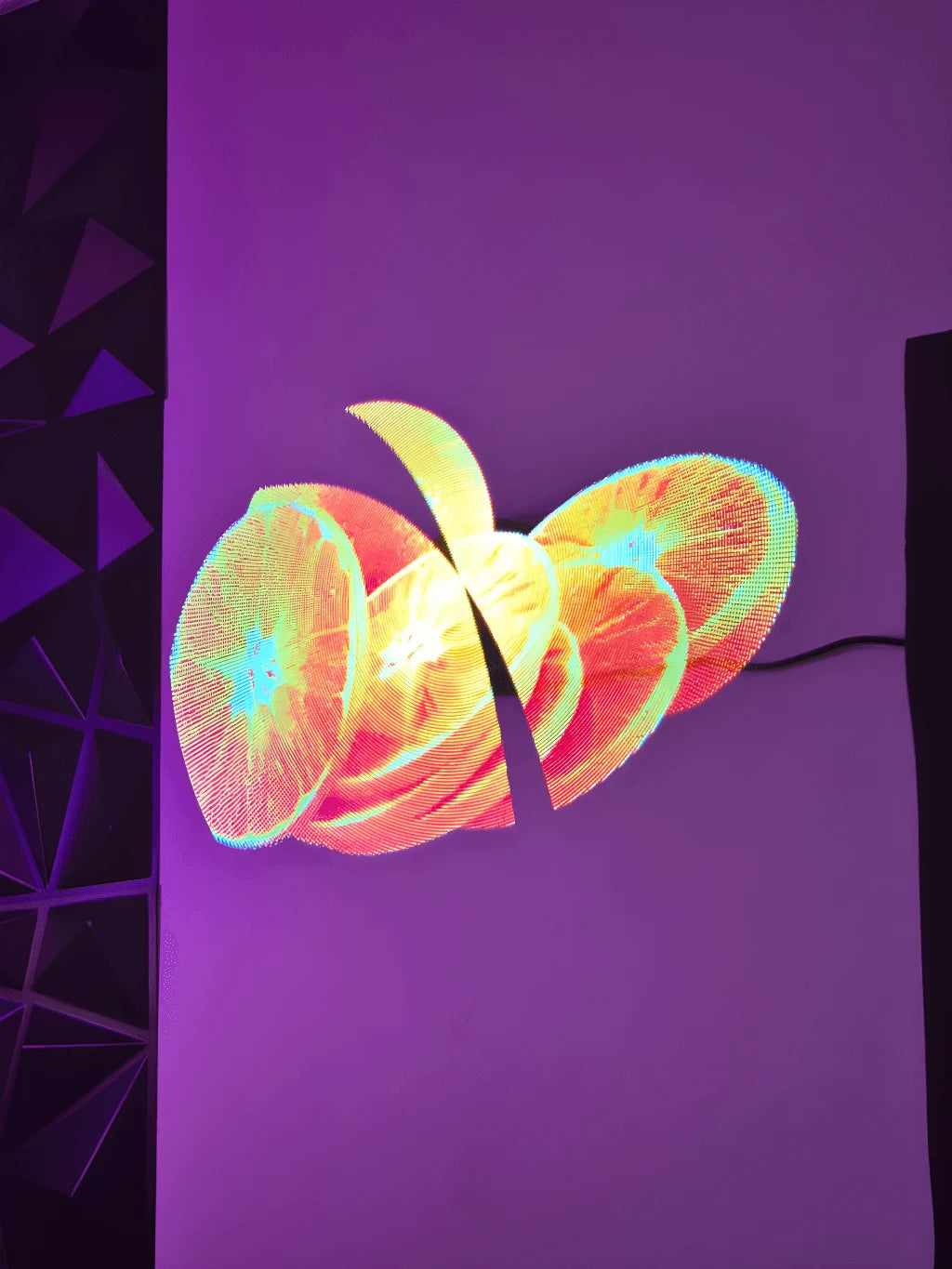 Holographic fan displaying glowing orange slices on a purple background
