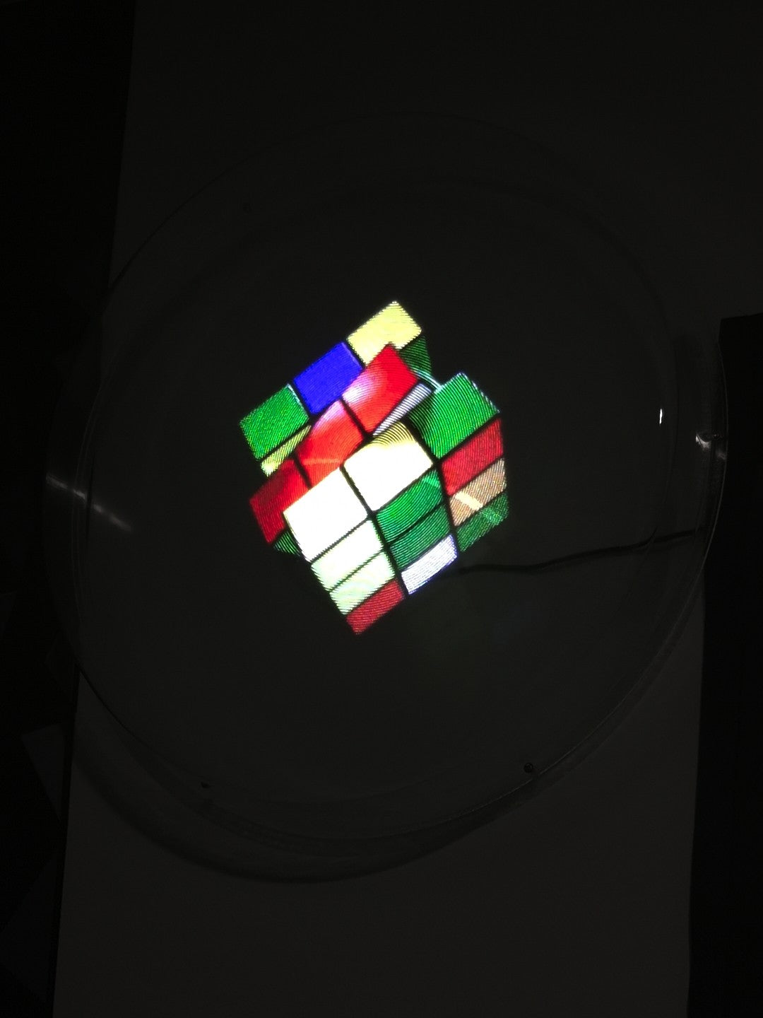 Holographic Rubik’s cube floating on a dark background