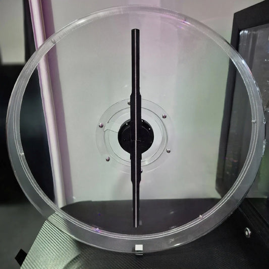 Clear circular protective cover with central black mounting shaft