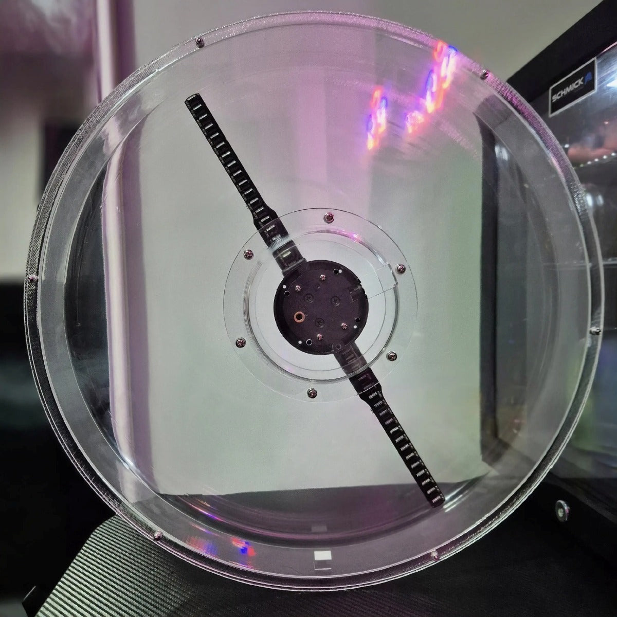 Rear view of the clear protective cover showing the hologram fan blade mechanism
